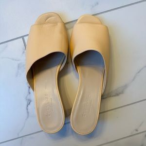 Never-worn nude/peach wedge slides